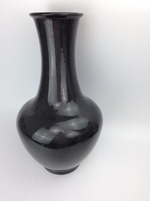 Fabrication de produits en fibres de carbone déposés à la main